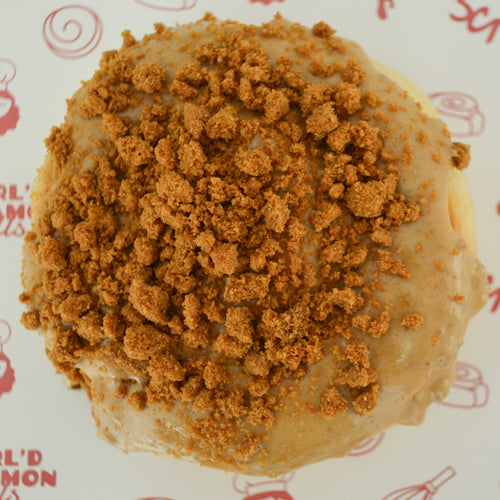 Biscoff filling topped with biscoff frosting topped and biscoff cookie crumbles