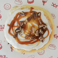 Cinnamon sugar filling topped with vanilla frosting, pecans and salted caramel